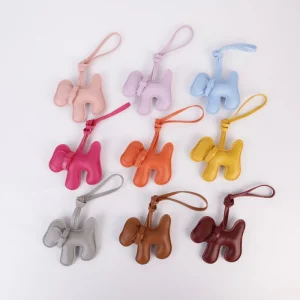 Cute Pink Puppy Bag Charm with Bow Detail Soft PU Leather Hanging Ornament for Handbag Backpack Luggage Accessories